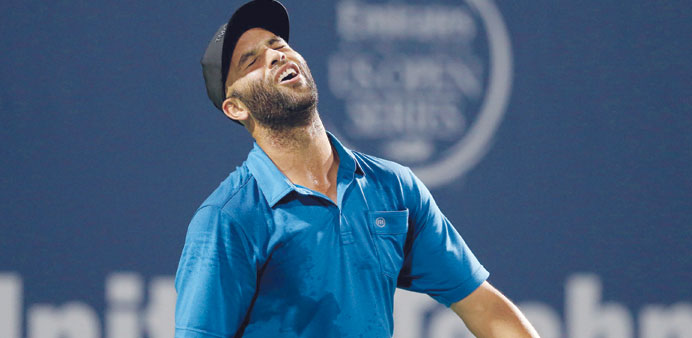 James Blake (left) reacts to a lost point to Andy Roddick (right) during their Legends match at the Connecticut Open in New Haven, Connecticut, on Thu