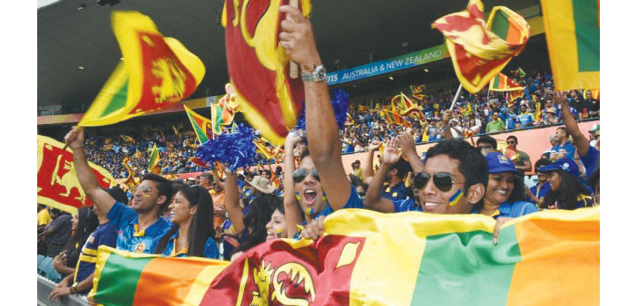 Sri Lankan fans wave their national flags during one of the games at the World Cup.