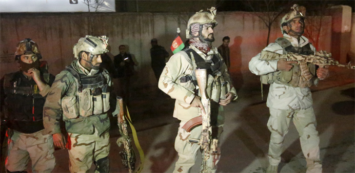 Members of Afghan Crisis Response Unit (CRU) arrive at the site of a Taliban attack 