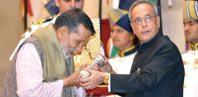 President Pranab Mukherjee (right) presenting the Gandhi Peace prize to environmentalist Chandi Prasad Bhatt in New Delhi yesterday.