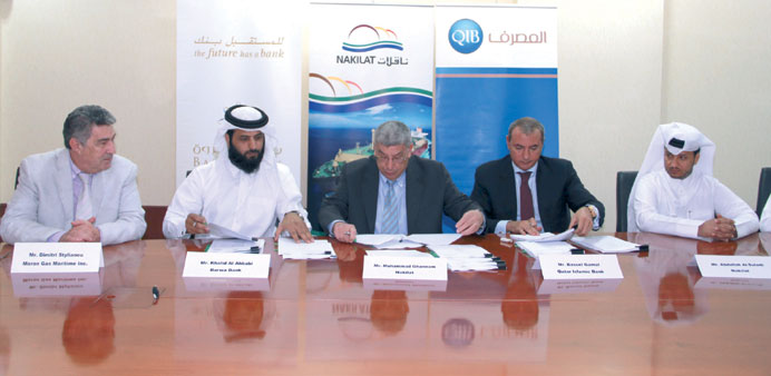 Officials of Nakilat Maran, QIB and Barwa Bank at the $662.4mn refinancing agreement signing in Doha yesterday.