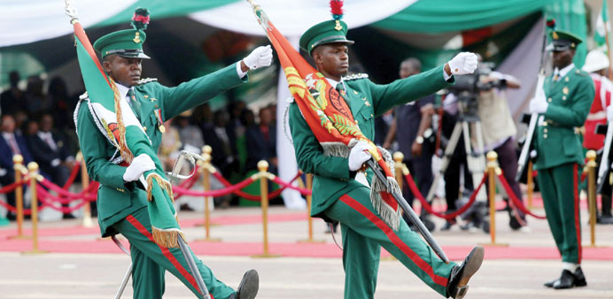 Nigerian honour guards march yesterday in Abuja as part of Nigeriau2019s independence anniversary celebrations.