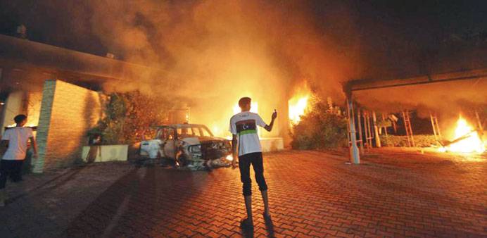 The Consulate in Benghazi is seen in flames during a protest by an armed group.