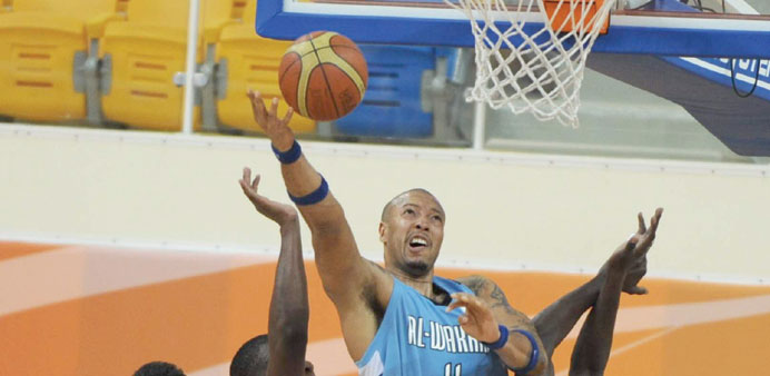 Al Wakrahu2019s Rashaad Singleton attempts to score against Al Ahli during the Qatar Cup at the Al Gharafa Indoor Hall yesterday. PICTURES: Othman Iraqi