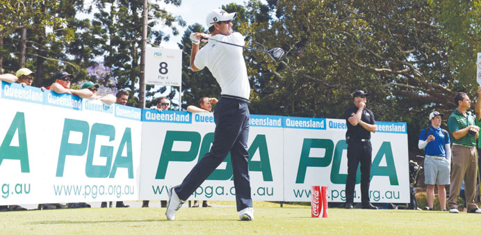Australian golfer Adam Scott tees off at a Pro-Am event ahead of the Australian PGA Championship at Royal Pines on the Gold Coast, Australia, yesterda
