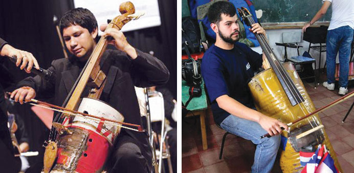 Musicians playing instruments made out of recycled materials.