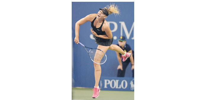 Russiau2019s Maria Sharapova in action against compatriot Maria Kirilenko  in the first round of the US Open yesterday.
