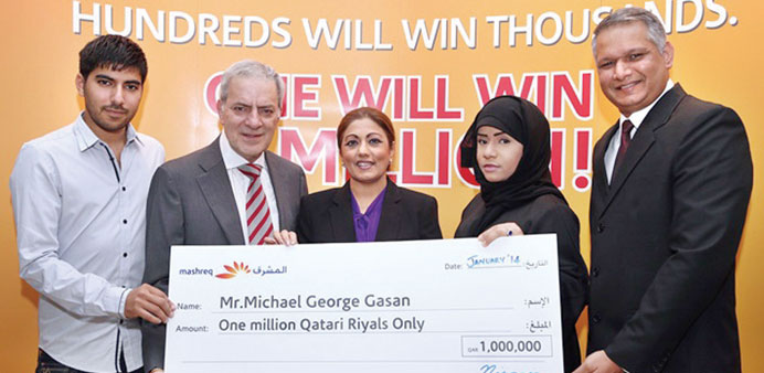 Michael George Gasan and his family accepting the MashreqMillionaire cheque from Niranjan Mendonca.