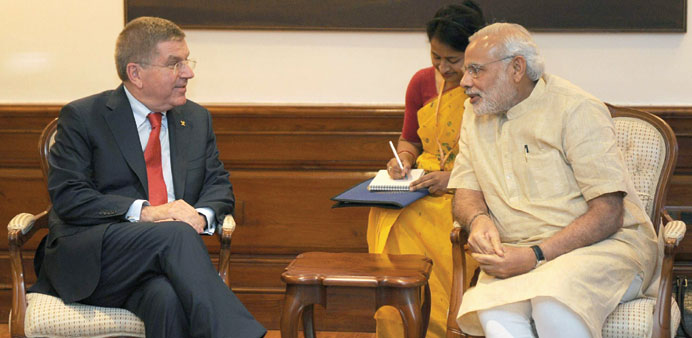 President of the International Olympic Committee Thomas Bach (left) talk to Indian Prime Minister Narendra Modi in New Delhi. (AFP)
