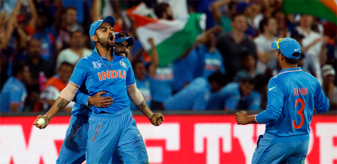 India's Virat Kohli (L) celebrates