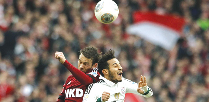 Bayern Munichu2019s Thaigo (right) and Markus Feulner of Nuremberg vie for the ball yesterday. (Reuters)