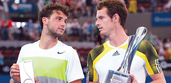 CHAMPIONS: Andy Murray of Britain (R) holds the trophy after defeating Grigor Dimitrov of Bulgaria (L) in the final of the Brisbane International tenn