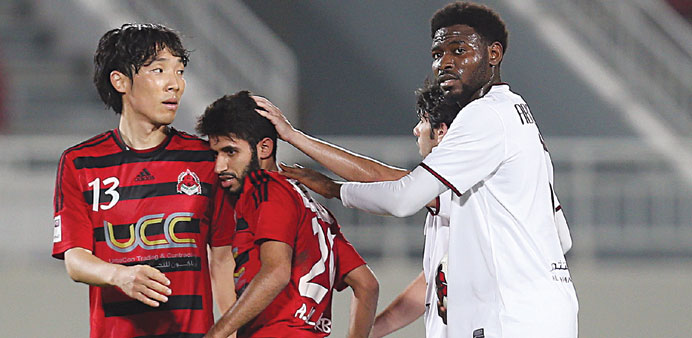 El Jaish players (in white) with their Al Rayyan counterparts after their QSL match yesterday.