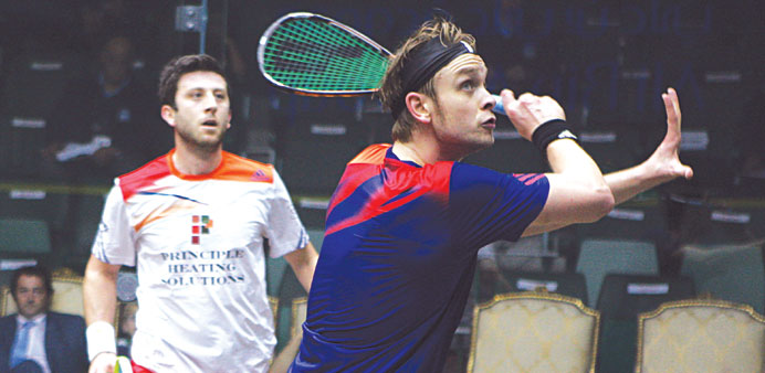 Englandu2019s James Willstrop (right) plays a shot against compatriot Daryl Selby during their Qatar Classic Squash match here yesterday. 