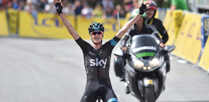 Chris Froome celebrates winning stage seven