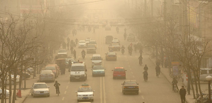 This file photo taken on December 9, 2009 shows smog down a main street of Linfen, in Chinau2019s Shanxi province, regarded as one of the cities with the 