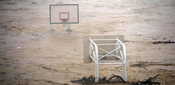 A basketball stadium is flooded by the Jingmei river as Typhoon Soudelor hit Taipei yesterday.