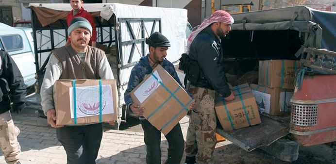  Boxes containing Qatari relief items being distributed to needy Syrians.