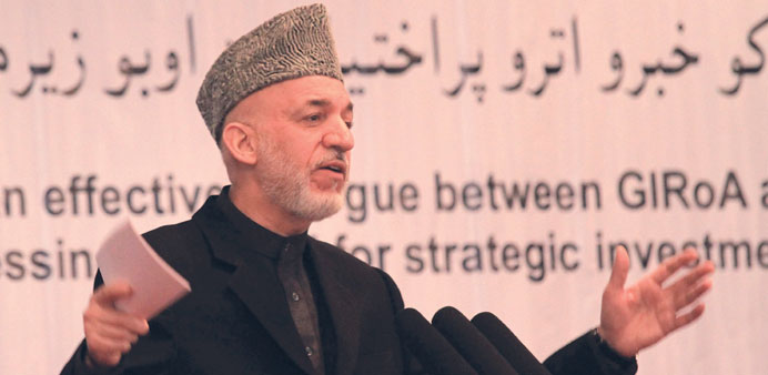 Afghan President Hamid Karzai talks with journalists during the 3rd National Conference on Water Resources in Kabul yesterday.