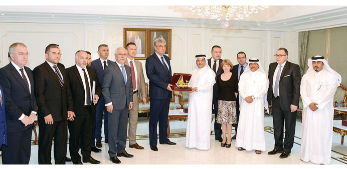 Al-Obaidly presenting Tudose with a memento during a visit to Qatar Chamber.