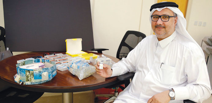 Dr Nasser al-Ansari displays the seized substances.