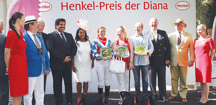 Qatar Racing and Equestrian Club general manager Sami Jassim al-Boanain (fourth from left) is seen with the winners of the Qatar Near Challenge Cup at