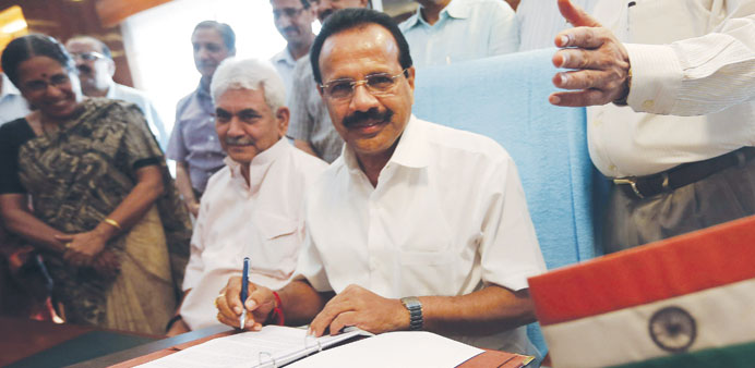 Railway Minister Sadananda Gowda poses after giving final touches to the railway budget for the 2014/15 fiscal year in New Delhi.