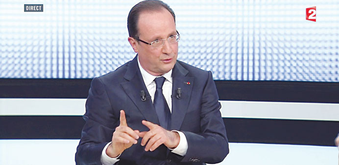 Hollande answers questions about the state of the French economy and high unemployment on Thursday night in his first such televised appearance in sev