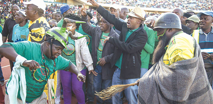 South African platinum miners dance at the Royal Bafokeng stadium near the northwestern town of Rustenburg yesterday.