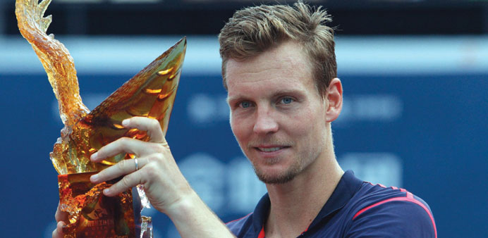 Tomas Berdych of the Czech Republic with the trophy after winning the Shenzhen open in Guangdong, China. (Reuters)