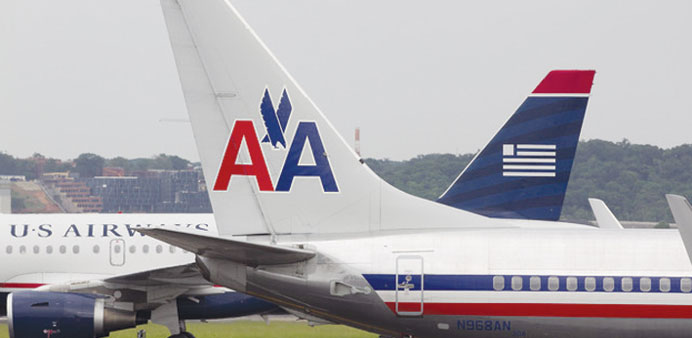 AMR Groupu2019s American Airlines and US Air aircraft pass each other. The airlines are seen merging thi
