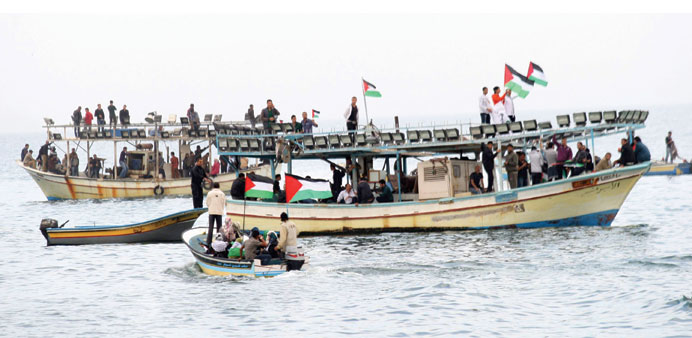 Activists aboard fishing boats take part in the protest against Israelu2019s naval blockade of Gaza yesterday.