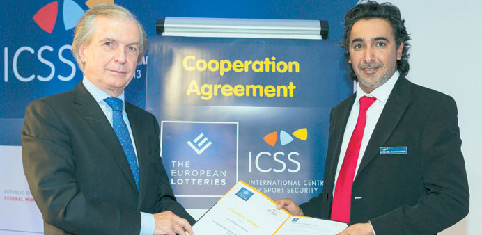 Stickler and Hanzab with the signed agreement at the 2013 ICSS Security Experts Summit, held at the Bundesministerium fur Inneres in Vienna, Austria.