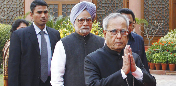 President Pranab Mukherjee and Prime Minister Manmohan Singh arrive at the Parliament House on the first day of the budget session yesterday.