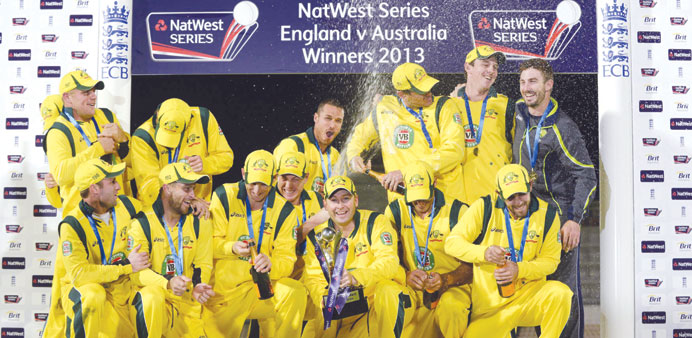 Australiau2019s Michael Clarke (bottom centre) holds the trophy after winning the fifth one-day international against England at the Rose Bowl in Southamp