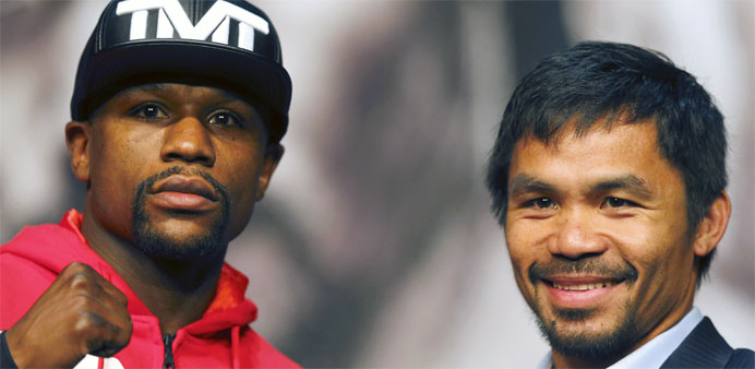 Floyd Mayweather Jr. (L) of the US and Manny Pacquiao of the Philippines