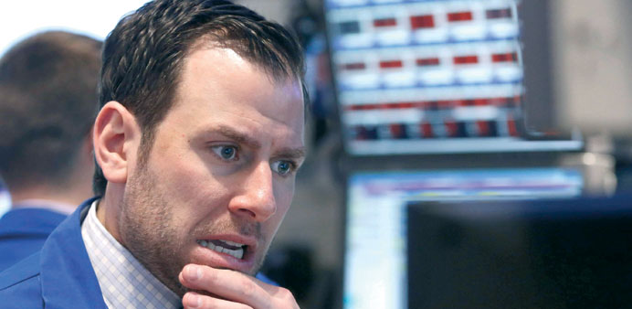 A trader monitoring share prices at the New York Stock Exchange yesterday.