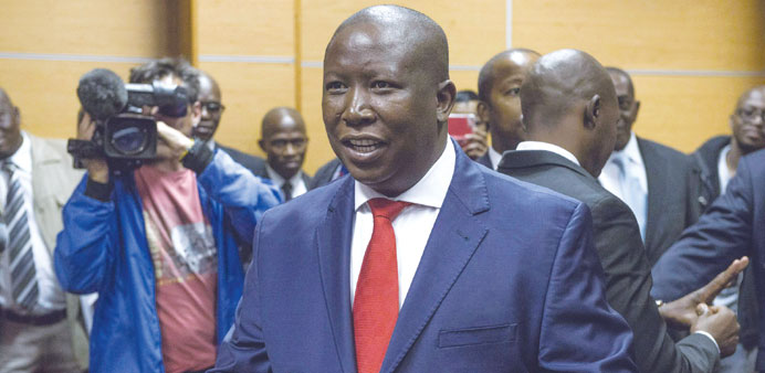 South African opposition party Economic Freedom Fighter leader Julius Malema arrives in the courtroom in Polokwane yesterday.