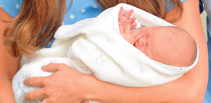Catherine, Duchess of Cambridge, holds her baby boy George Alexander Louis.