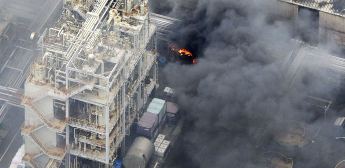Smoke rises after a fire broke out at a Nippon Steel & Sumikin Pipe Co factory in Kawasaki, south of Tokyo, yesterday.