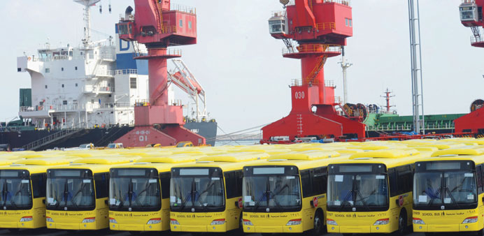 Buses wait to be exported at Lianyungang port. Chinau2019s monthly trade surplus leaped to a record $47.3bn in July, nearly tripling year-on-year, officia