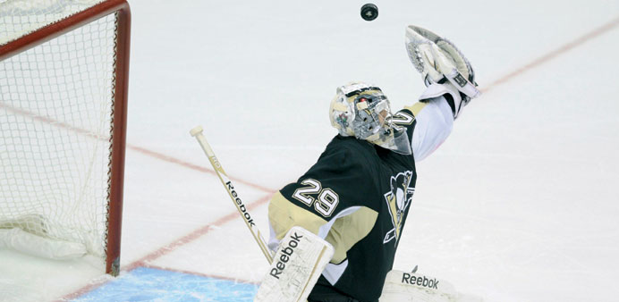 Pittsburgh Penguins goaltender Marc-Andre Fleury (29) makes a save against the New York Rangers in the third period of their NHL game in Pittsburgh, P