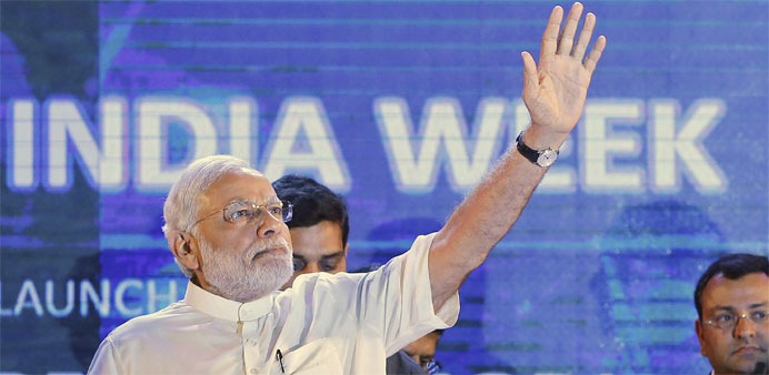 Modi waves during the launch of 'Digital India Week' in New Delhi