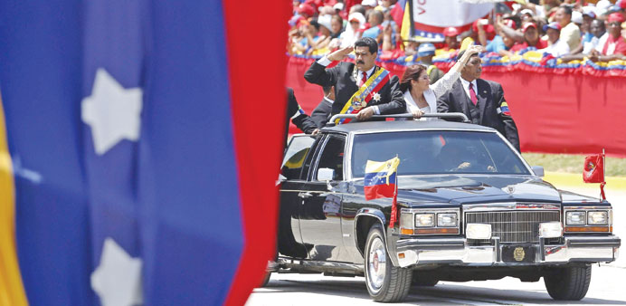 Venezuelan President Nicolas Maduro arrives at a military parade to commemorate the first anniversary of the death of late president Hugo Chavez in Ca