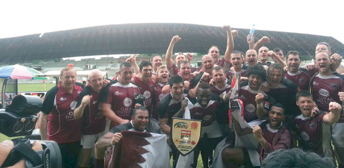   Qatar players celebrate after winning HSBC Asian 5 Nations Division III final.