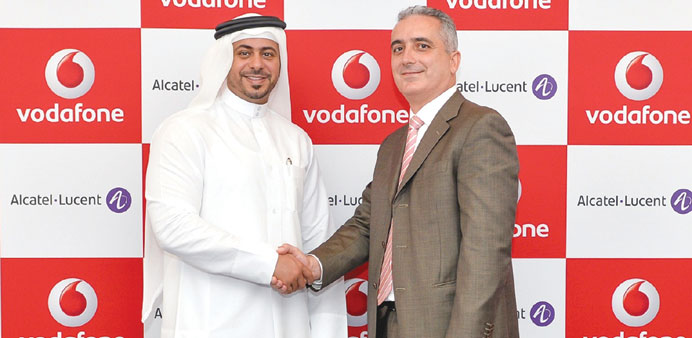 Mohamed al-Sadah, chief administration officer at Vodafone Qatar, with Henrique Vale, chief executive officer of Alcatel-Lucent in Qatar.