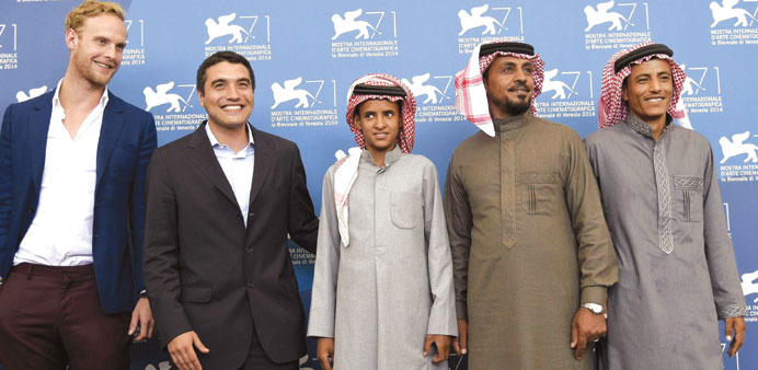 British actor Jack Fox, director Naji Abu Nowar, and Bedouin actors Jacir Eid, Hassan Mutlag and Hussein Salameh pose during a photocall for Theeb in 