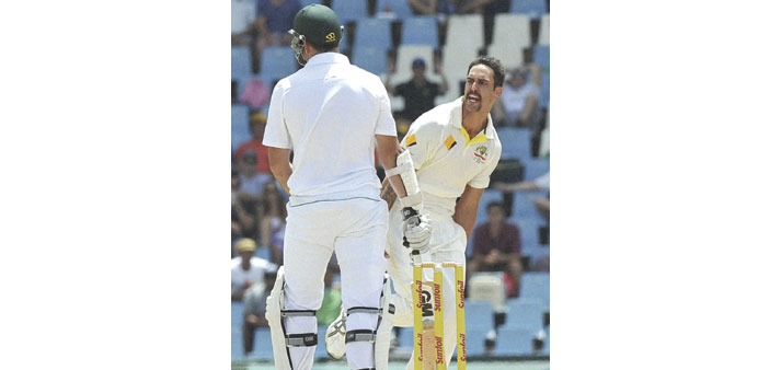 TOO HOT TO HANDLE: Johnson nails SA skipper Smith in the first Test.