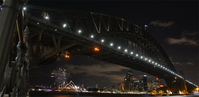 Fireworks fade as lights go out on the Sydney Harbour Bridge and Opera House to signal the start of the Earth Hour environmental campaign