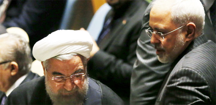 Iranian President Hassan Rouhani (L) and Iranian Foreign Minister Mohammad Javad Zarif arrive for UN meeting